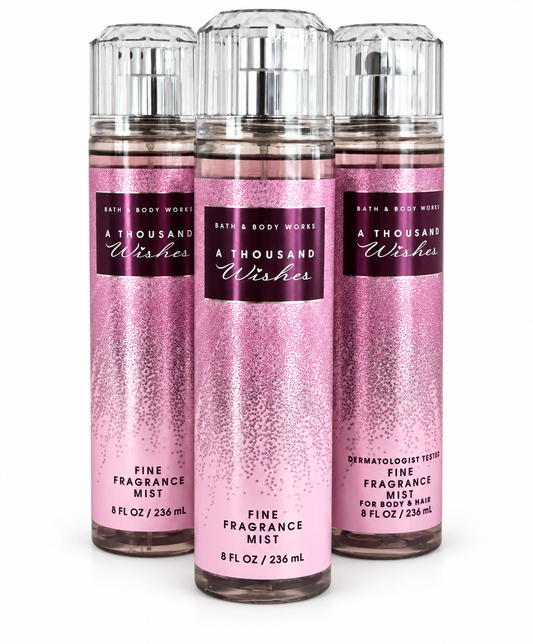 Bath & Body Works A Thousand Wishes Fine Fragrance Mist 3 Pack, three full-size 8 oz body mist bottles with pink glitter packaging, sweet floral fragrance.