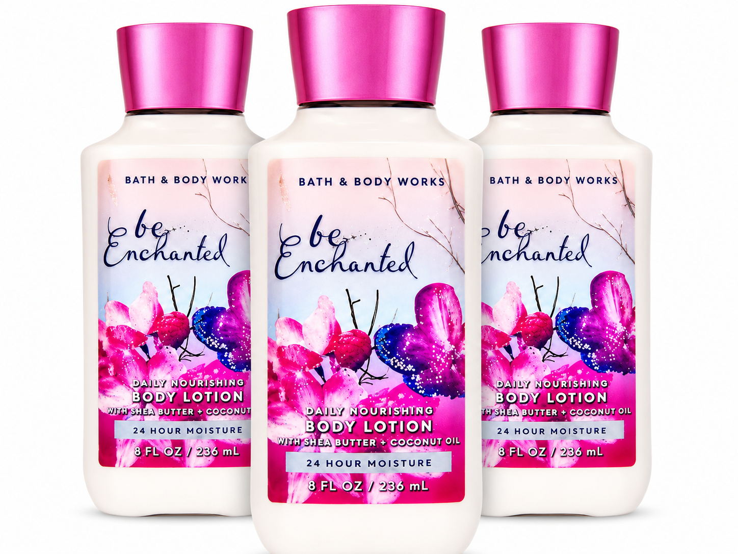 Bath & Body Works BE ENCHANTED Daily Nourishing Body Lotion 3-Pack 8 oz bottles arranged in MWG style with one bottle in front and two slightly behind featuring sparkling berries, frosted florals and creamy vanilla musk with Shea Butter and Coconut Oil on a pure white background for gifting and everyday hydration