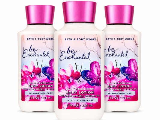 Bath & Body Works BE ENCHANTED Daily Nourishing Body Lotion 3-Pack 8 oz bottles arranged in MWG style with one bottle in front and two slightly behind featuring sparkling berries, frosted florals and creamy vanilla musk with Shea Butter and Coconut Oil on a pure white background for gifting and everyday hydration