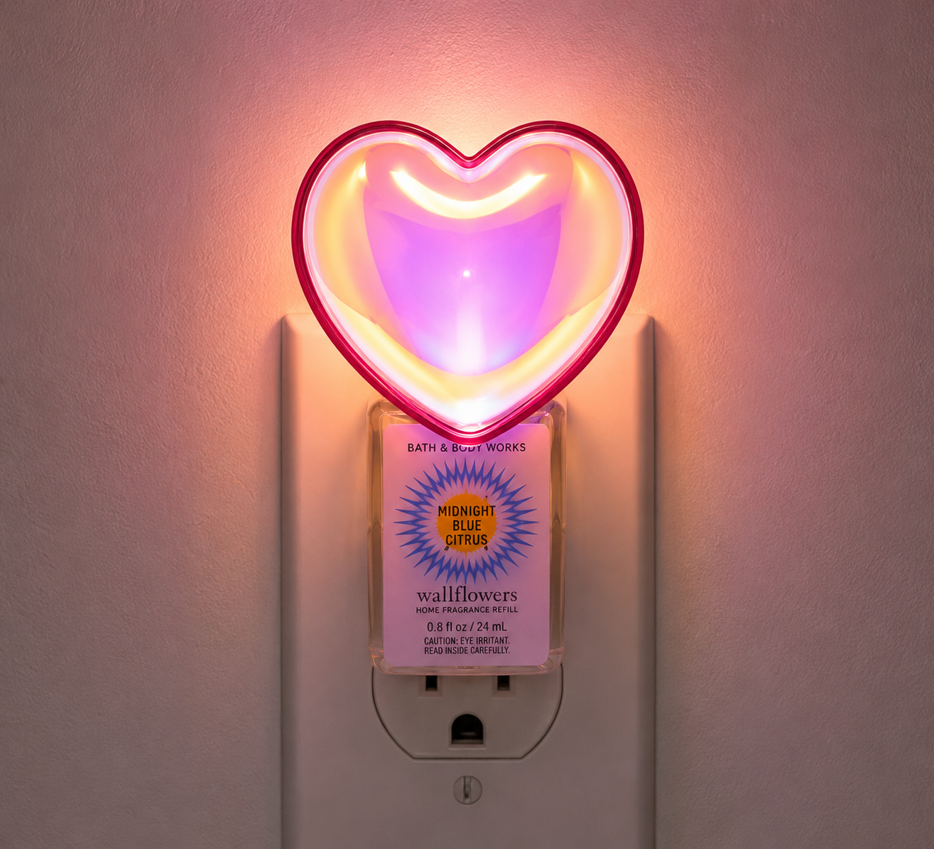 Bath & Body Works HEART NIGHTLIGHT Wallflowers plug illuminated in a wall outlet