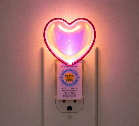 Bath & Body Works HEART NIGHTLIGHT Wallflowers plug illuminated in a wall outlet