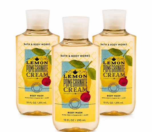 Bath & Body Works LEMON POMEGRANATE CREAM Body Wash 3-Pack 10 oz bottles arranged in MWG style with one bottle in front and two slightly behind featuring bright lemon, juicy pomegranate and sweet cream fragrance with Pro-Vitamin B5 and Aloe on a pure white background for gifting and everyday use