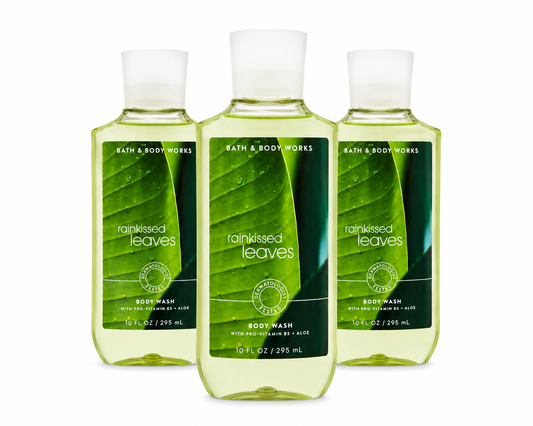 Bath & Body Works RAINKISSED LEAVES Body Wash 3-Pack 10 oz bottles arranged in MWG style with one bottle in front and two slightly behind on a pure white background featuring a fresh green botanical fragrance inspired by rain-kissed leaves