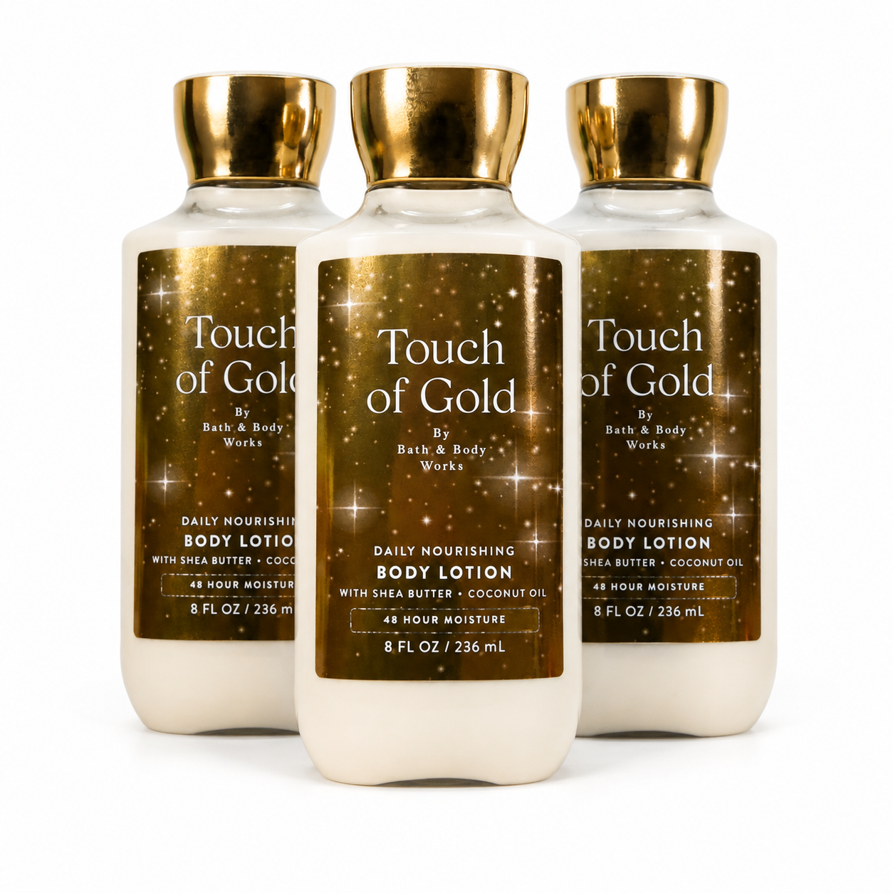 Bath & Body Works Touch of Gold body lotion 3-pack with one bottle in front and two behind on white background