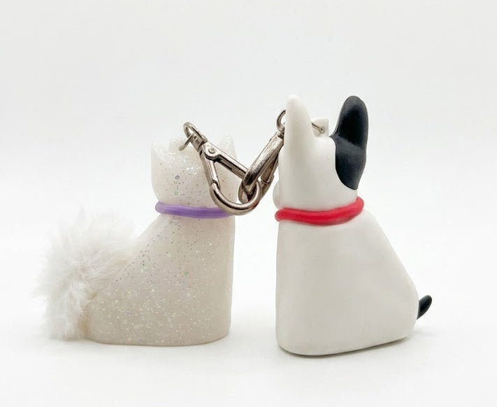 Bath & Body Works PocketBac holder set back view showing keychain clip detail dog and cat sanitizer holder