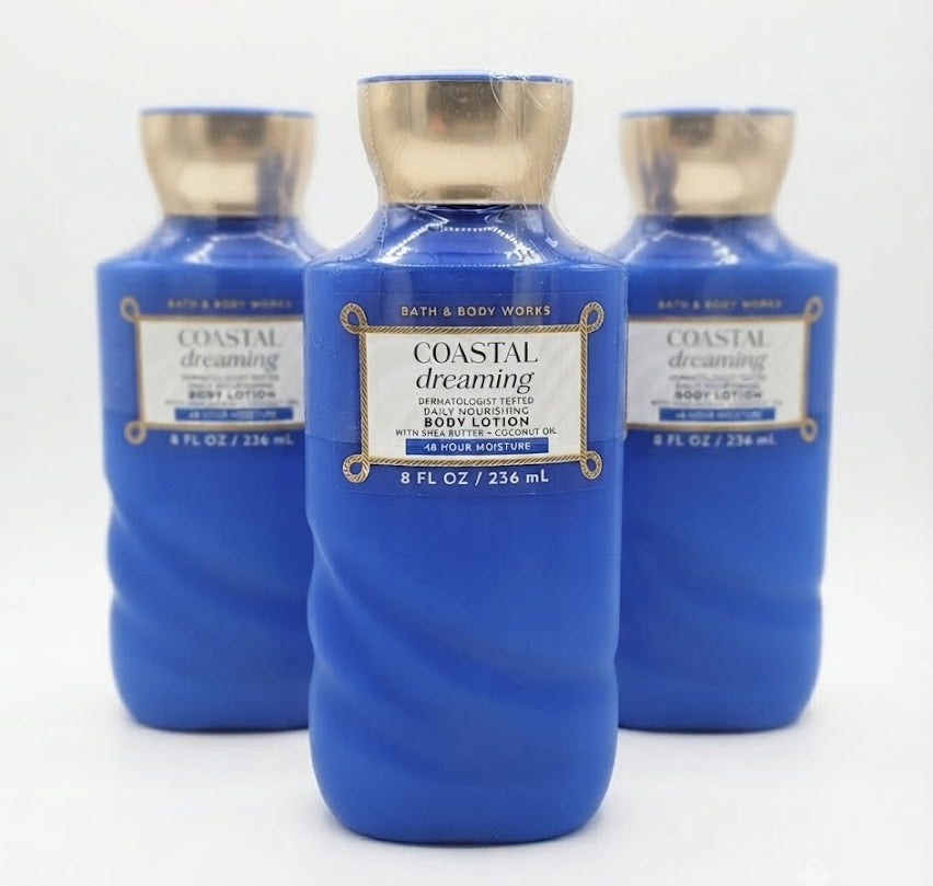 Three identical 8 oz Bath & Body Works Coastal Dreaming daily nourishing body lotion bottles in a triangular formation against a plain white background.