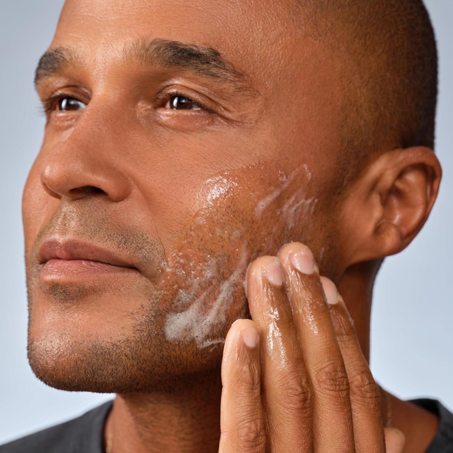 Luxury men’s grooming lifestyle image showing Caldera + Lab The Clean Slate facial cleanser used in a premium skincare routine.