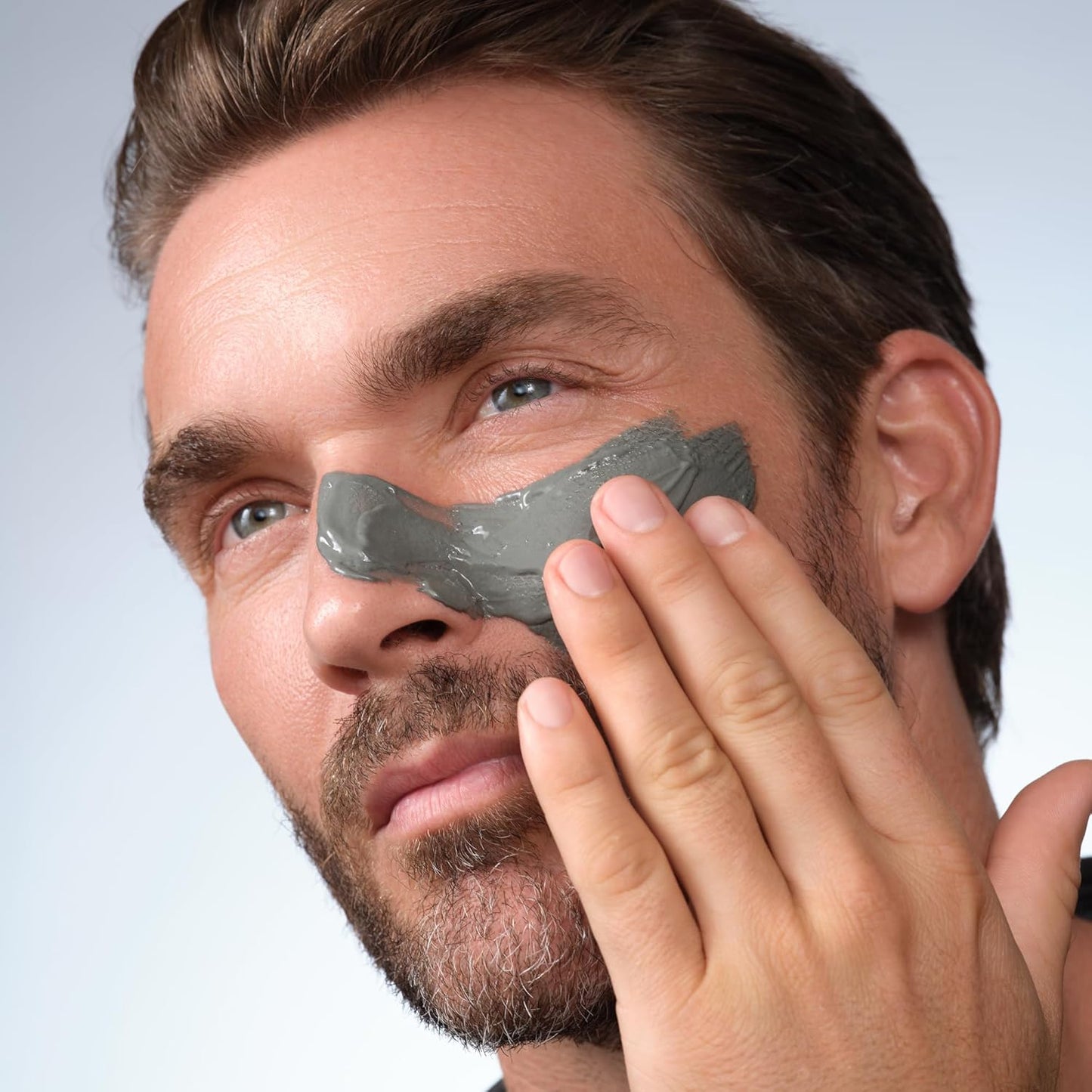Luxury men's skincare lifestyle image featuring Caldera + Lab The Deep face mask as part of a premium grooming routine.
