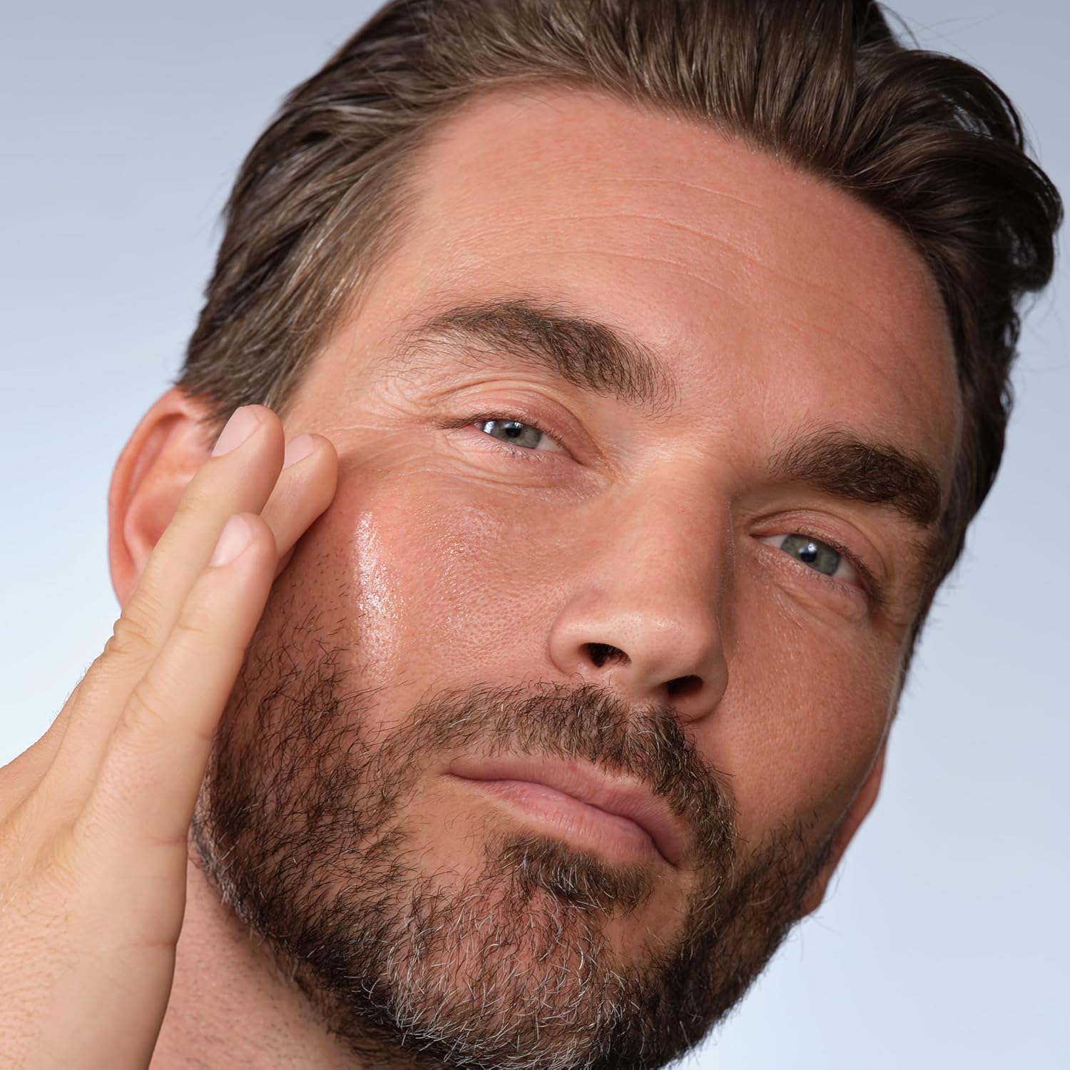 Luxury men’s skincare lifestyle image featuring Caldera + Lab The Good face serum for healthier-looking smoother hydrated skin.