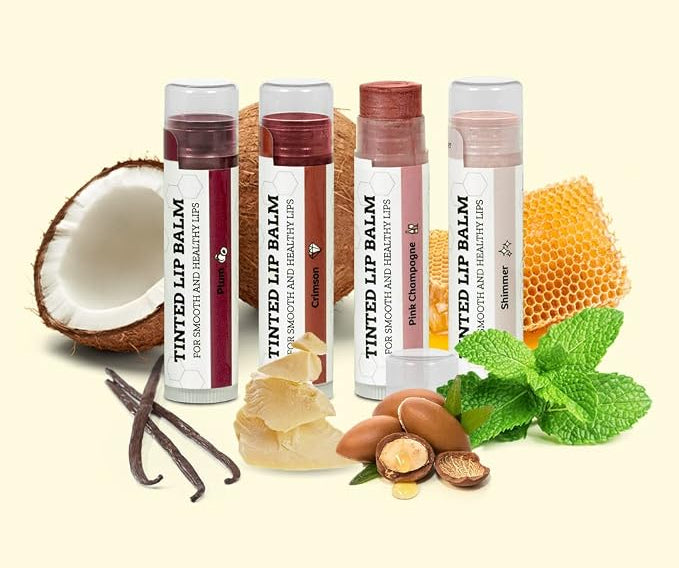 Four EARTH'S DAUGHTER tinted lip balms displayed with coconut, cocoa butter and botanical ingredients