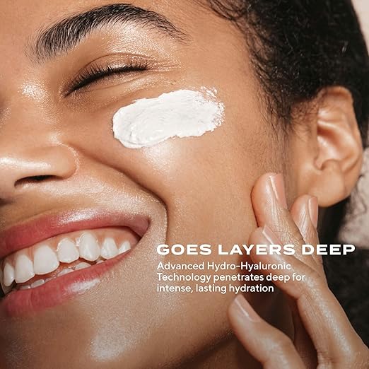 Model applying MURAD Restorative Hydro-Hyaluronic Cream to deeply hydrate, soften, and plump dry skin