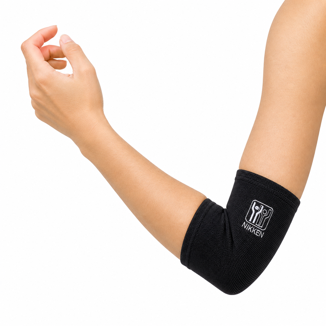 Closeup of arm wearing NIKKEN KenkoTherm elbow support wrap with breathable compression fit and flexible comfort