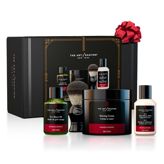 THE ART OF SHAVING Sandalwood Luxury Shaving Kit for Men featuring premium grooming essentials including shaving cream, pre-shave oil, after-shave balm, shaving brush, and luxury gift box packaging.
